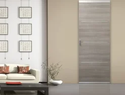 Système coulissant pour pose invisible porte en bois